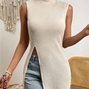 Long waffled crew cream top, sleeveless with a slit in front